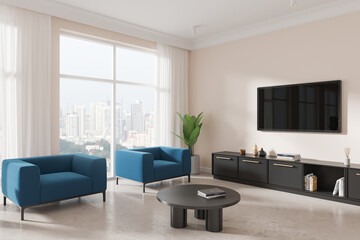 Light home living room interior with armchairs and tv, panoramic window