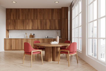 Modern home kitchen interior with dining table, cabinet and panoramic window