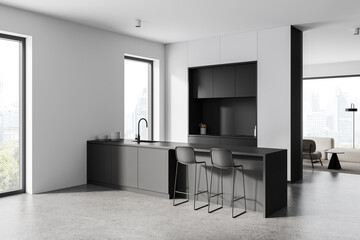 Modern minimalist kitchen with sleek black cabinets and barstools. 3D Rendering