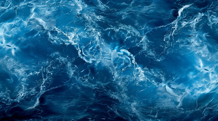 Fototapeta premium The image is of a body of water with a blue color. The water appears to be moving and has a lot of waves. Scene is calm and peaceful, as the water seems to be still and serene