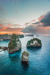 Sunrise in the morning against the backdrop of cliffs with blue ocean on Nusa Penida Island, Bali, Indonesia summer background © Balnyes Visuals