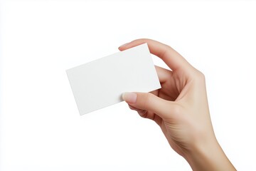 Obraz premium Close-up of a hand holding a blank white business card, isolated on a bright white background. Ideal for branding, identity presentations, or business mockups