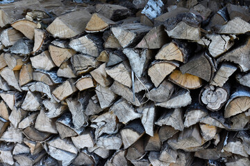 Firewood for the winter, stacked in a pile