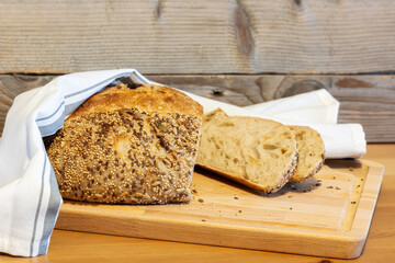 Homemade bread, sourdough wheat loaf with seeds
