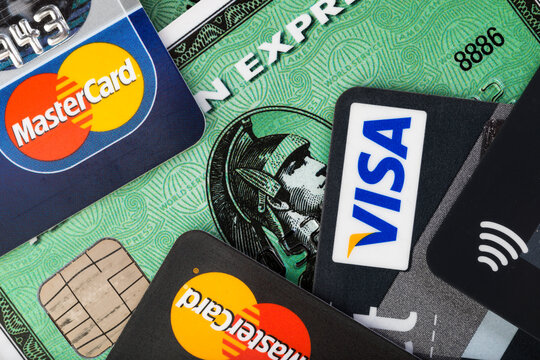 Close up of credit cards by major brands VISA, American Express and Mastercard