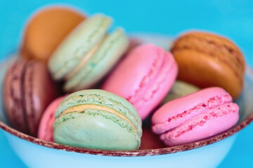 Cake macaron or macaroon on turquoise background