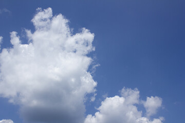 
Blue sky with puffy clouds