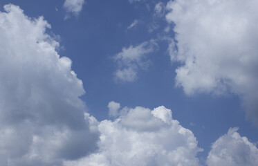 
Blue sky with puffy clouds