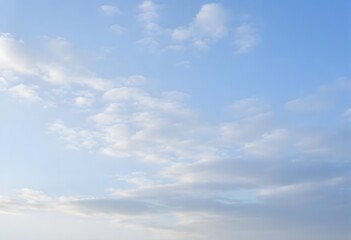 Clear blue sky with a single, fluffy white cloud drifting across it
