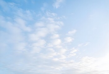 Obraz premium Clear blue sky with a single, fluffy white cloud drifting across it