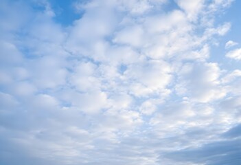 Obraz premium Clear blue sky with a single, fluffy white cloud drifting across it