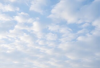 Fototapeta premium Clear blue sky with a single, fluffy white cloud drifting across it