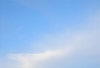 Summer day with a bright blue sky and scattered white clouds