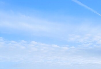 Summer day with a bright blue sky and scattered white clouds