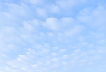 Fototapeta premium Summer day with a bright blue sky and scattered white clouds