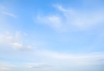  Clear blue sky with fluffy white clouds drifting slowly