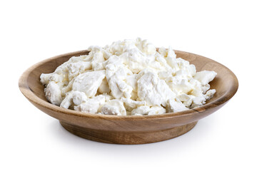 Cottage cheese in a wooden bowl isolated on white background. With clipping path.