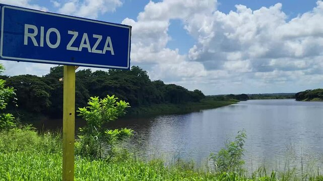 Road sign of the zaza river in Cuba with the zaza river in the background