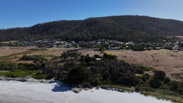 Aerial view of Bicheno town and the white sandy beach in Tasmania, Australia.