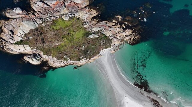 Top down view of Bicheno island and the azure ocean waters of Tasmania, Australia.