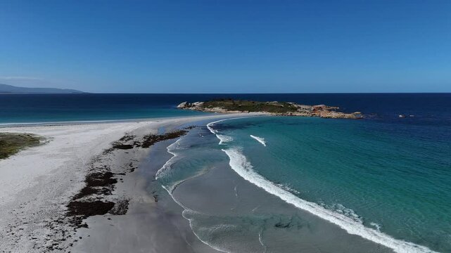 Drone flight over the white sand beach of Bicheno Island in Tasmania, Australia.