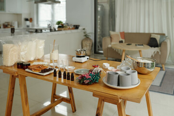 Different objects on table in the room preparing for handmade candles