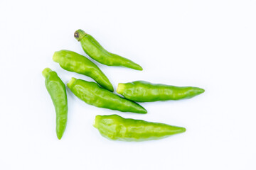 Isolated Green Chilies on Clean White Surface – Culinary Spice Highlight

