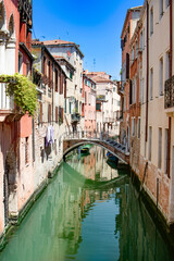 Venice, Italy. A stunning view of a tranquil canal in Venice, highlighting the beauty of traditional Italian architecture