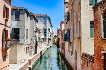 Venice, Italy. A stunning view of a tranquil canal in Venice, highlighting the beauty of traditional Italian architecture