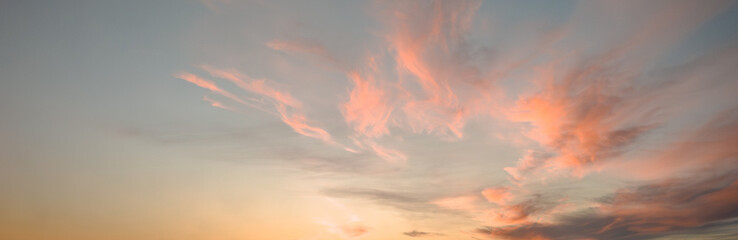 Pink clouds at sunset in the evening sky