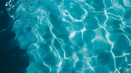 Obraz premium Top view on clear blue pool water surface with ripples and light reflections