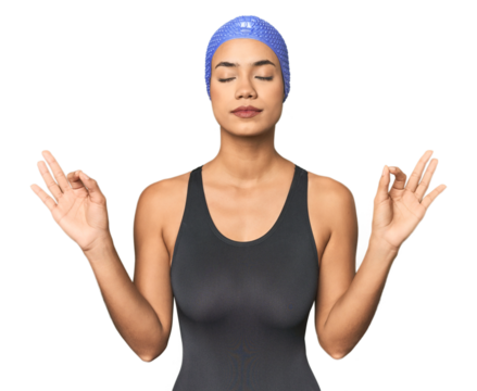 Pro Latina swimmer in studio gear relaxes after hard working day, she is performing yoga. - Powered by Adobe