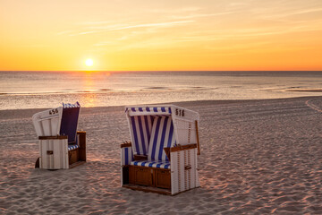 Hornum, Sylt - beach chairs at North Sea in sunset