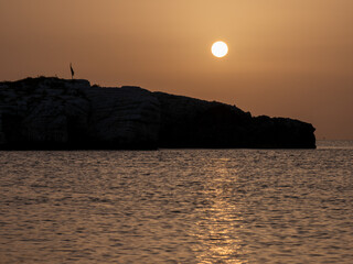 Beautiful sunrise over the Adriatic Sea and Campi island. Baia and Cala Campi, Vieste, Gargano...