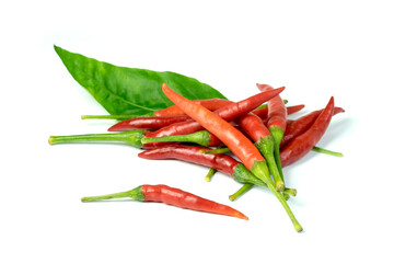 Fresh red chili pepper (Capsicum frutescens L.) whole  fruits with green leaves  isolated on white background closed up
