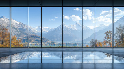 Naklejka premium Experience the breathtaking mountain view showcased from a striking modern glass structure