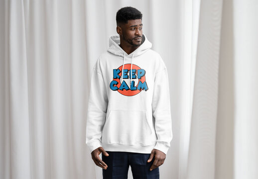 Mockup Of Man Wearing Customizable Hoodie In Studio