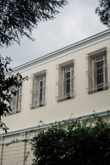 metal bars on the windows of the building on the top floor