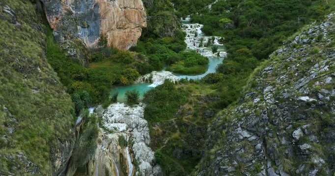 Amazing aerial drone shot of the beautiful Millpu lake with turquoise water located in the highlands of Peru, Ayacucho during a sunny afternoon.