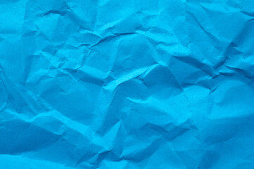 Full frame shot of crumpled blue  paper sheet texture and background.