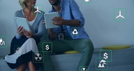 Animation of eco icons and data processing over diverse business people in office - Powered by Adobe