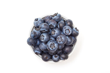 A bowl of fresh blueberries isolated on a white background. Top view