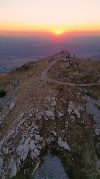 Rtanj mountain. Aerial view of the first rays of the rising sun above monumental church on mountain peak Siljak.