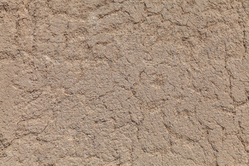 Old adobe wall closeup in sunny day