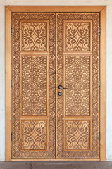 A carved wooden door from the walnut wood.