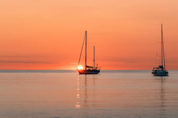 Silhouette Of A Pleasure Boat Moored In The Harbor Of The Coastal And Touristic Village Of...