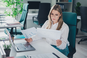 Portrait of successful young pretty lady desktop laptop read papers wear shirt office business center indoors