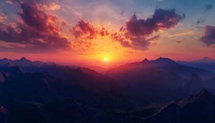 Fototapeta premium Sunset in the Mountains with Vibrant Sky Silhouetted Peaks