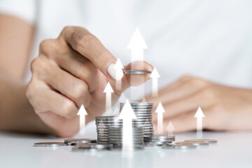 Stack Coins with Upward Arrows Symbolizing Financial Growth, Investment Success, and Economic...