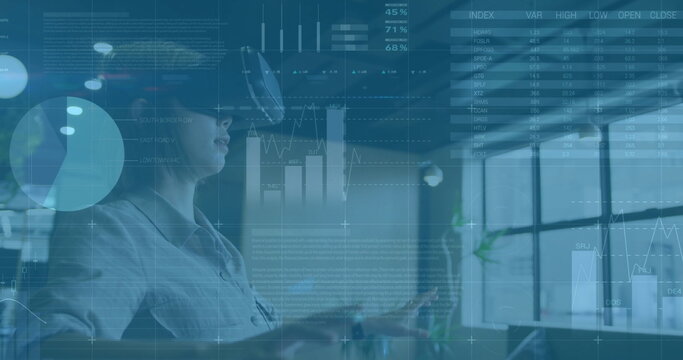 Image of financial data processing over asian businesswoman wearing vr headset